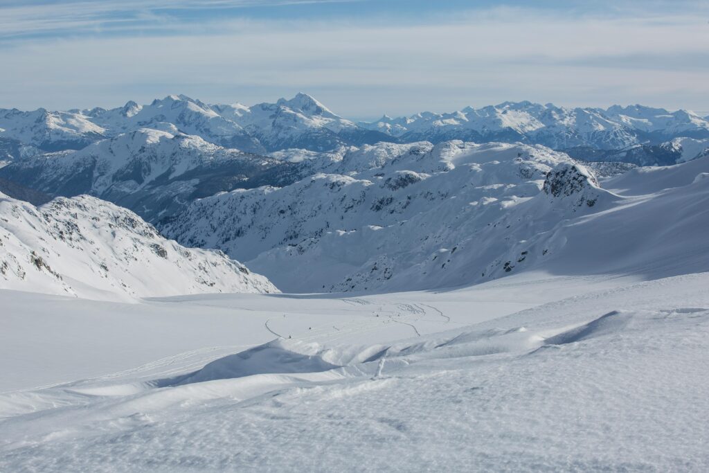 Stunning high-altitude view of snow-covered Canadian mountains on a crisp winter day.